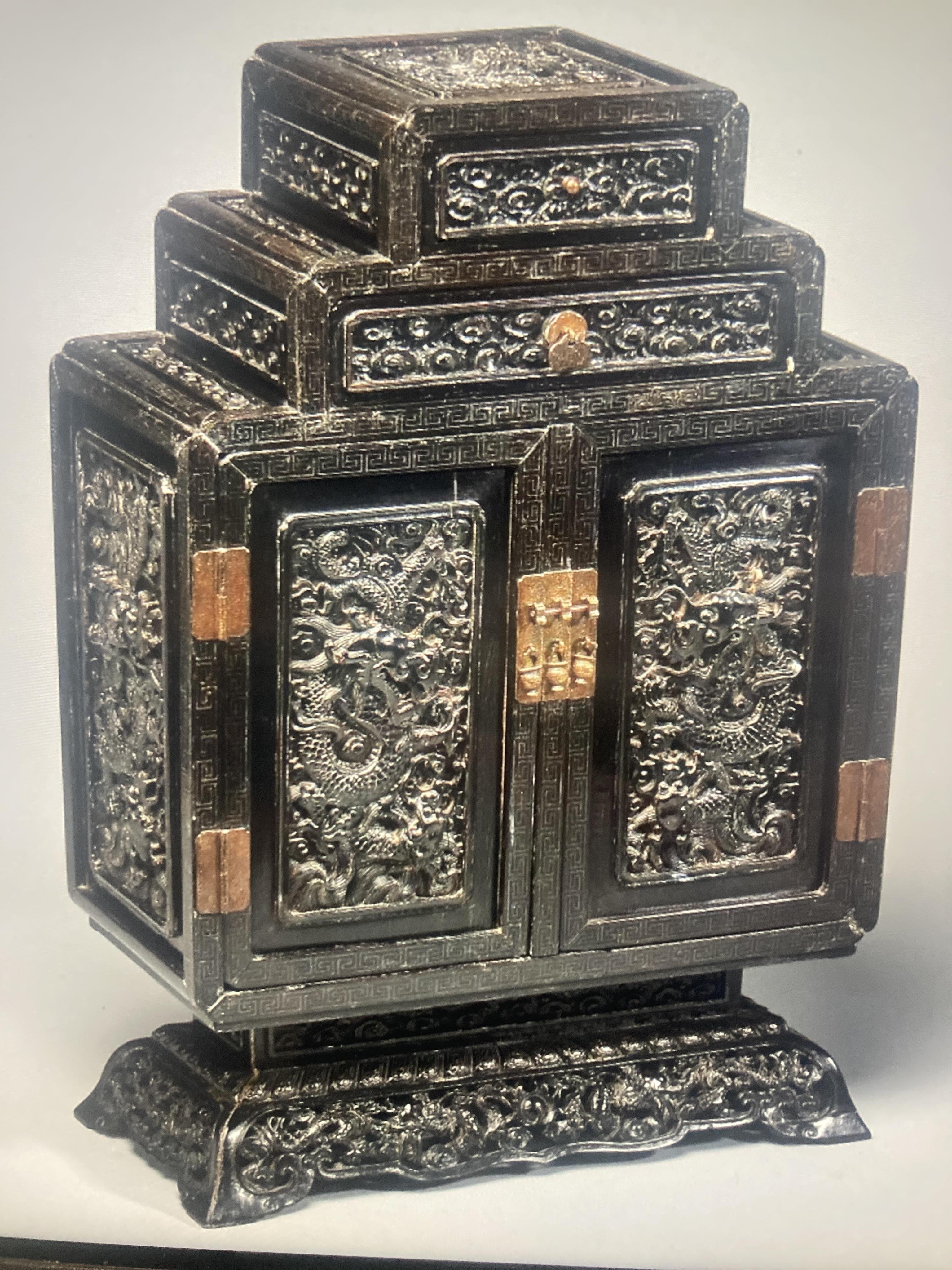 An important pair of Chinese carved zitan and silver wire inlaid ‘cloud and dragon’ curio cabinets and stands, duobaoge, probably Imperial, late Qing dynasty